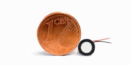 Comparison of our smallest ultrasonic transducer with a 1 cent coin