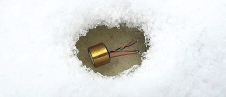 Transducer with heater melts hole in snow